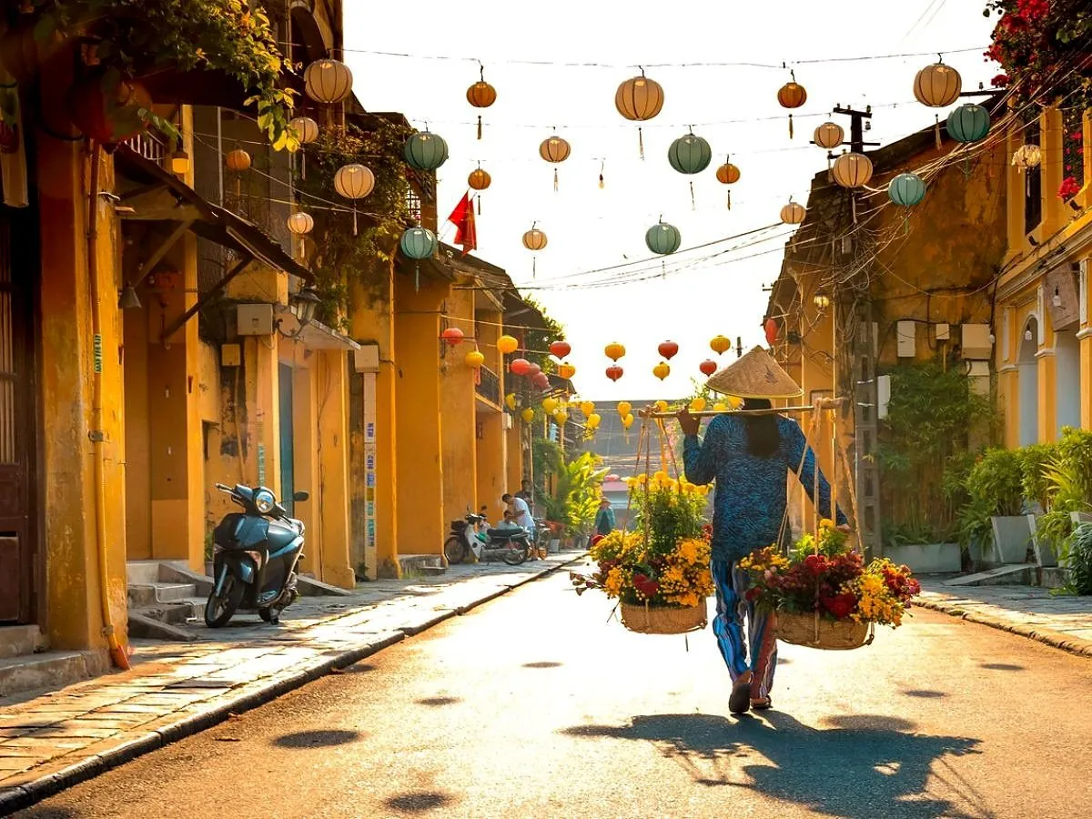 A cyclist on a lantern-lined street in Hoi An Old Town
