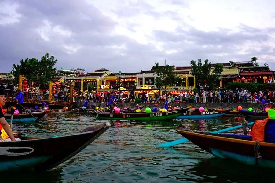Boats on the Hoi An river at dusk