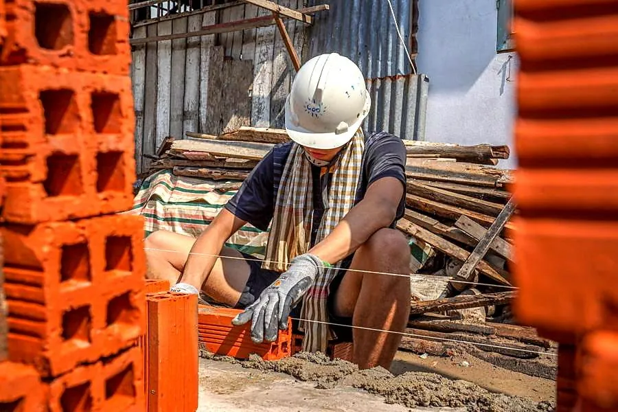 A local construction worker at a brick-building project in the Mekong Delta