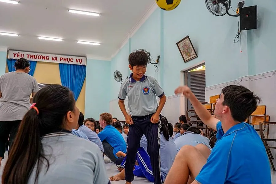 A student speaking during a school cultural exchange in Vietnam