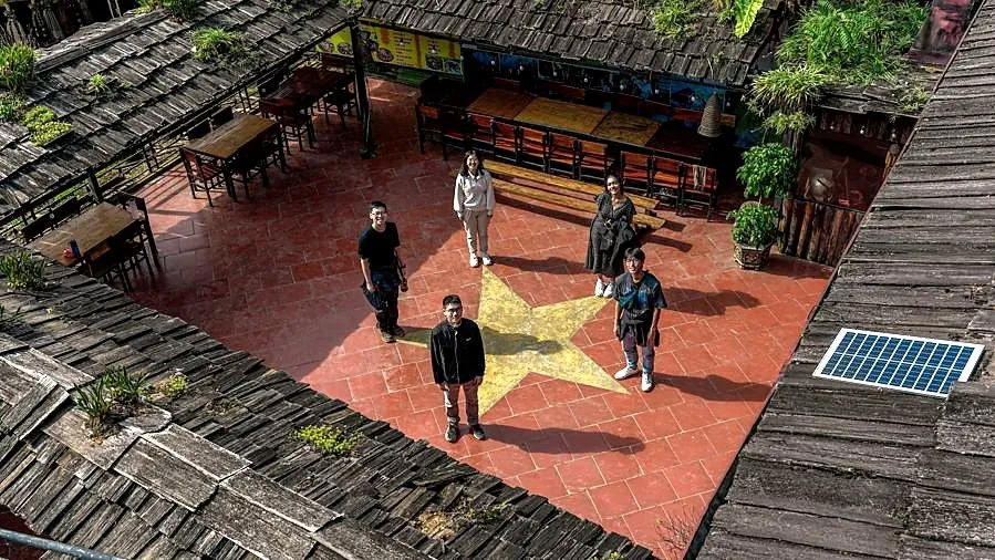 Students gathered in a community courtyard in Sapa
