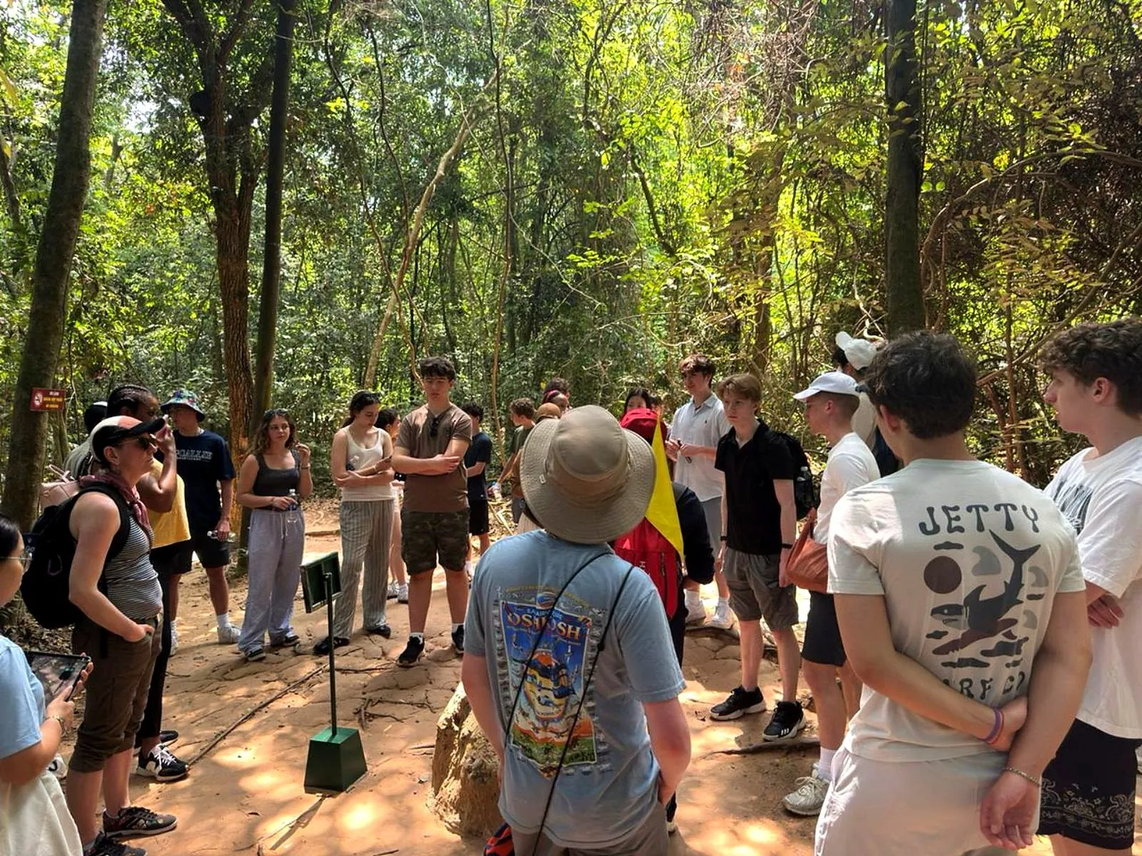 Students discussing history at a war-memory site in Vietnam