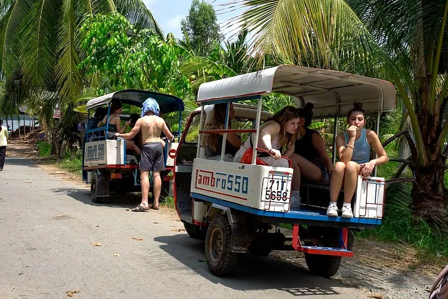 Students travelling by local vehicle in the Mekong Delta