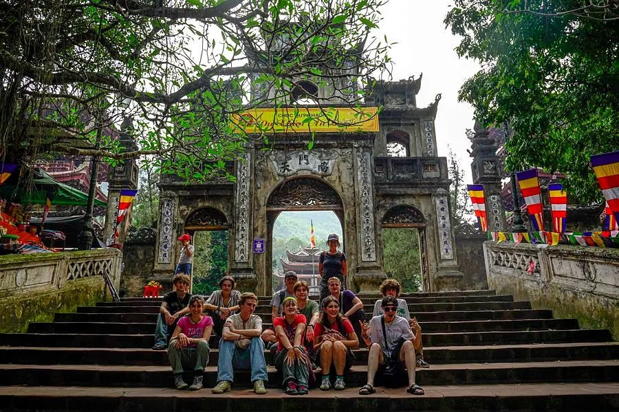 Students visiting a temple courtyard in Vietnam