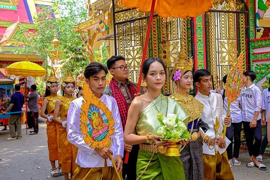 Students observing a religious procession in Vietnam
